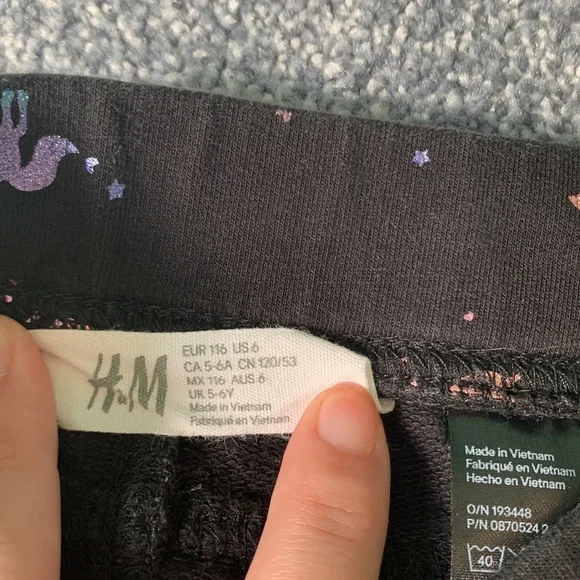 Girls black pants with colorful sparkly unicorn pattern. Size 6. Brand H&M. - Picture 3 of 6